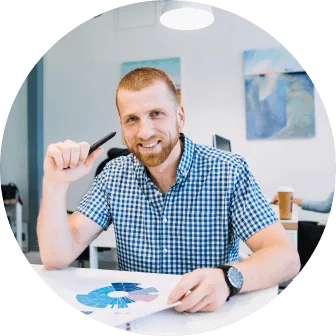 Business consultant reviewing analytics and business strategy services in a modern office workspace